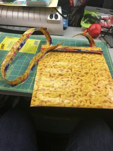 Image of an iPad case with strap made from duct tape