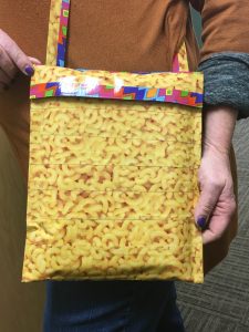 Image of an iPad carrying case made from macaroni and cheese duct tape.