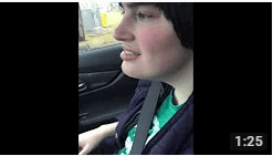 Image of young woman in a car