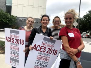 Image of ACES volunteers with signs.