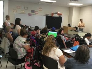 Image of ACES participants hearing a speaker on Healthy Relationships