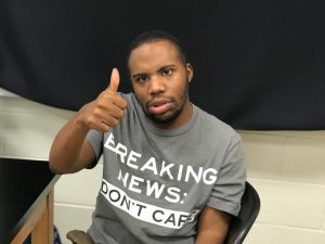 Image of young man giving thumbs up