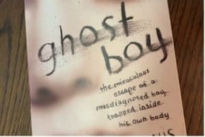 Book cover of Ghost Boy, a faded boy's face under the handwritten title. 